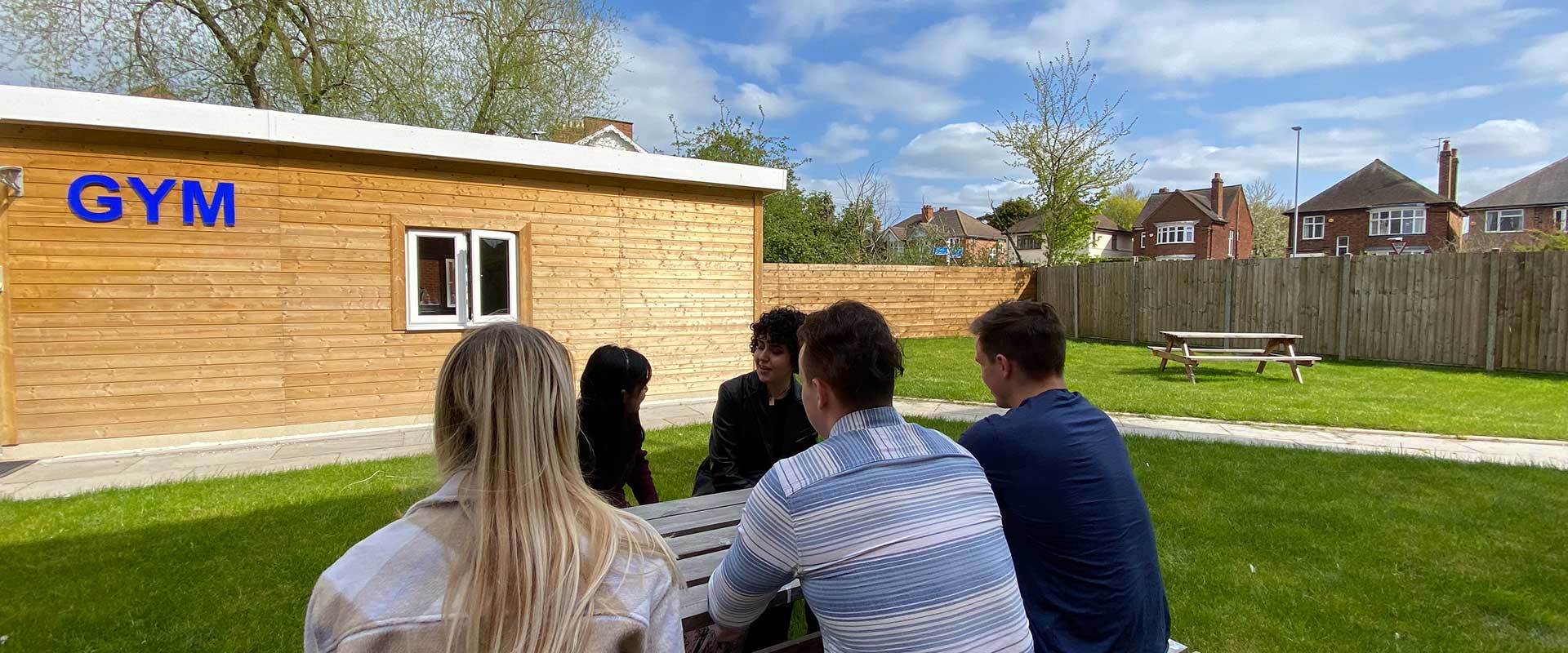 Kingfisher Halls Loughborough student accommodation - Relax in the sun with your flatmates 
